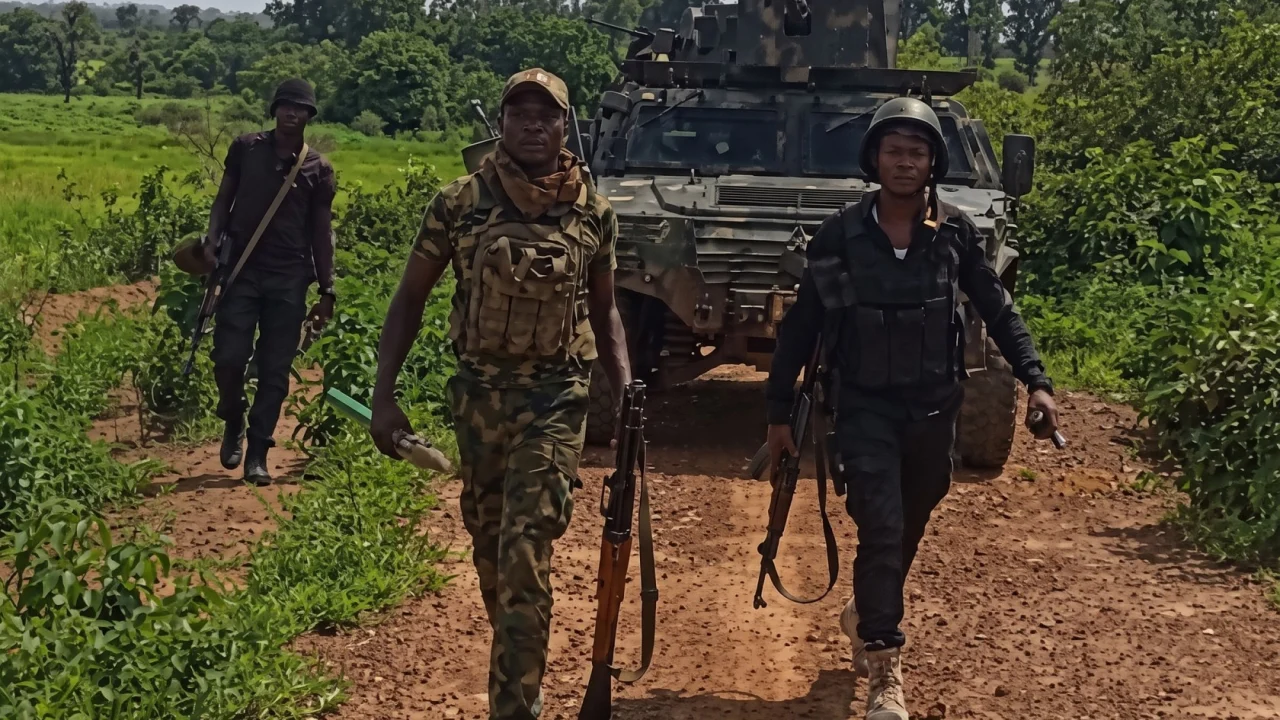 Nigerian security forces conducting tactical counter-banditry patrol along a rural road in Zamfara State following the rescue of abducted clerics